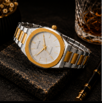 Two-tone gold and silver stainless steel men's watch with white textured dial, octagonal bezel, and minimalist luxury design