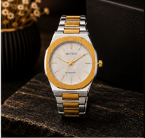 Two-tone gold and silver stainless steel men's watch with white textured dial, octagonal bezel, and minimalist luxury design