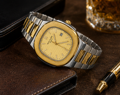 A luxury watch with a gold-toned wood-textured dial and case, paired with a two-tone silver and gold metal link bracelet, resting on a brown leather surface next to a glass of whiskey.