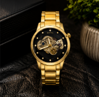 Gold stainless steel skeleton men's watch with transparent mechanical dial, automatic movement design, and luxury finish